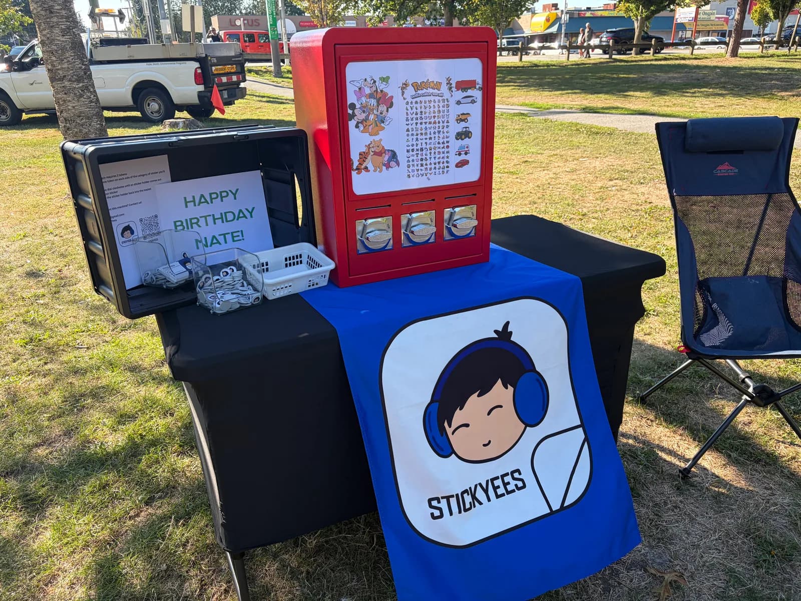 The StickYees insert-coin sticker machine set up at a party